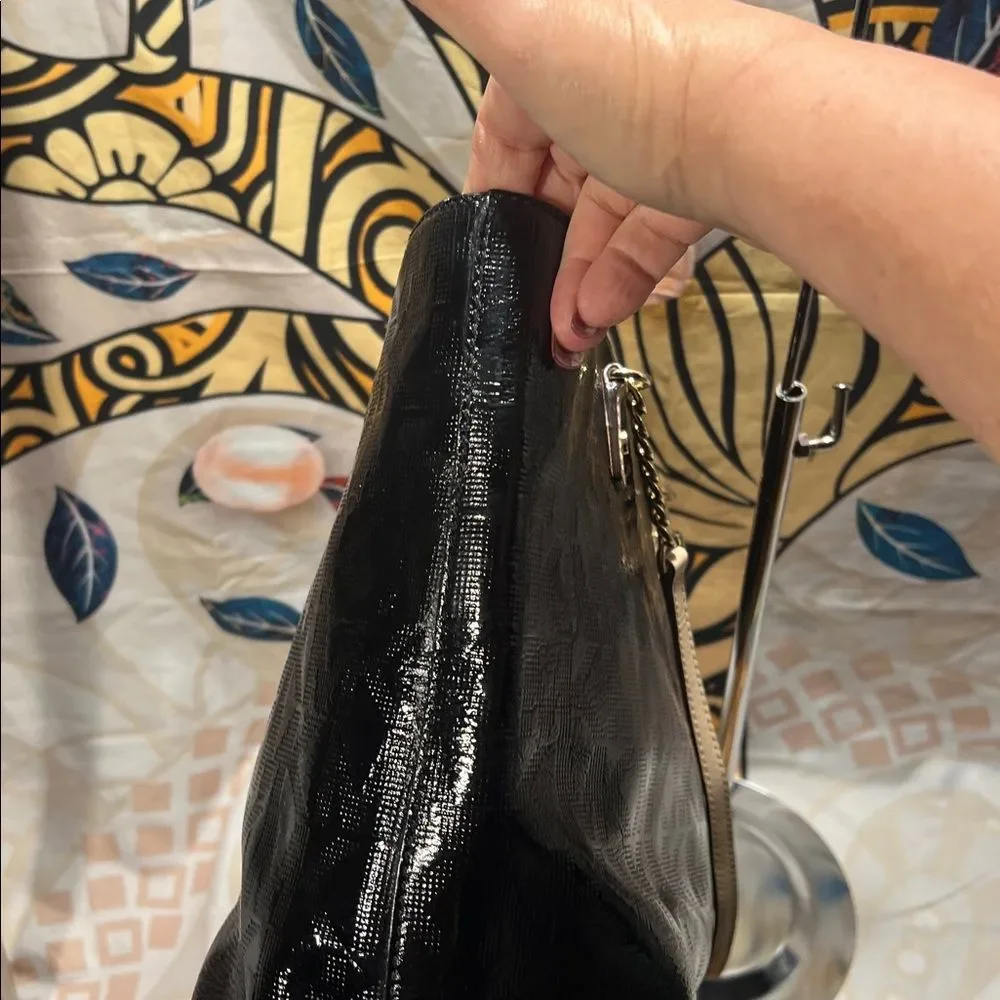 Michael Kors Jet Set Chain Tote in black patent leather with gold hardware.